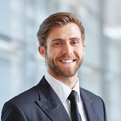 depositphotos_97431594-stock-photo-businessman-smiling-confidently-at-camera (1)