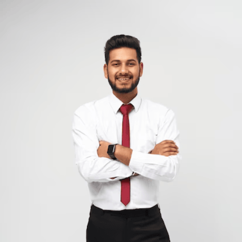 portrait-young-indian-top-manager-t-shirt-tie-crossed-arms-smiling-white-isolated-wall_496169-1513